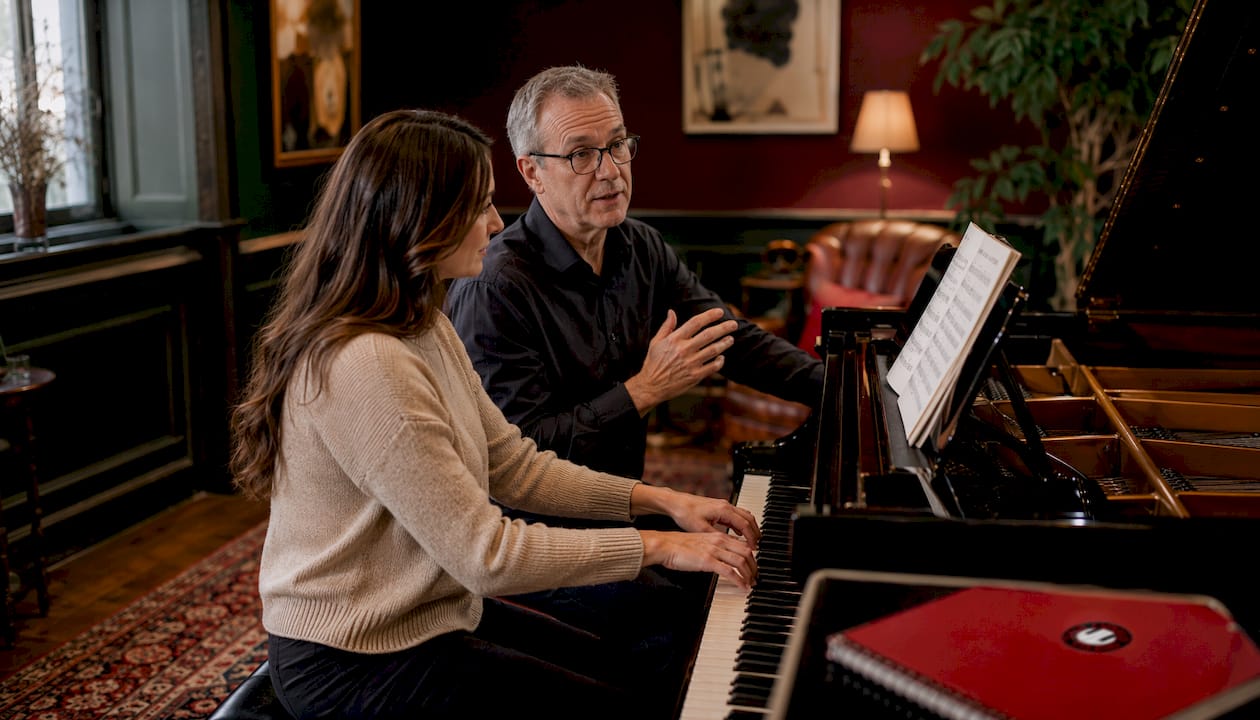 Adult piano lesson with teacher and student