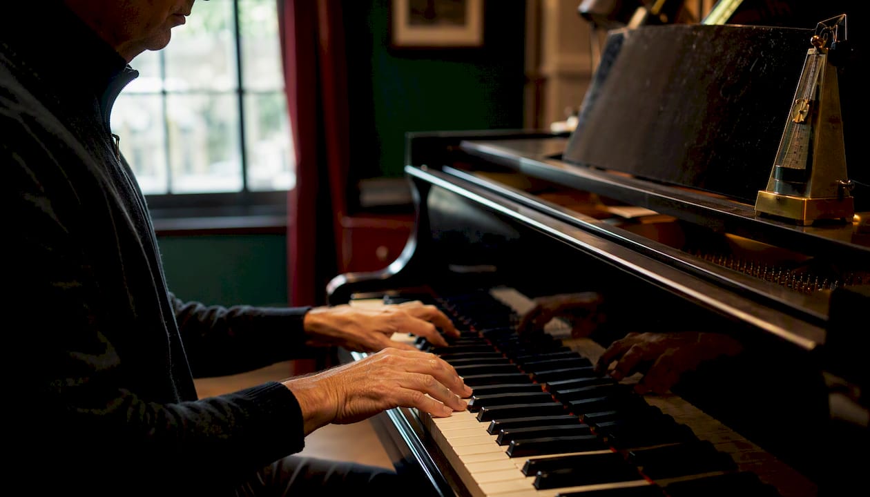 Hands playing piano chord inversions