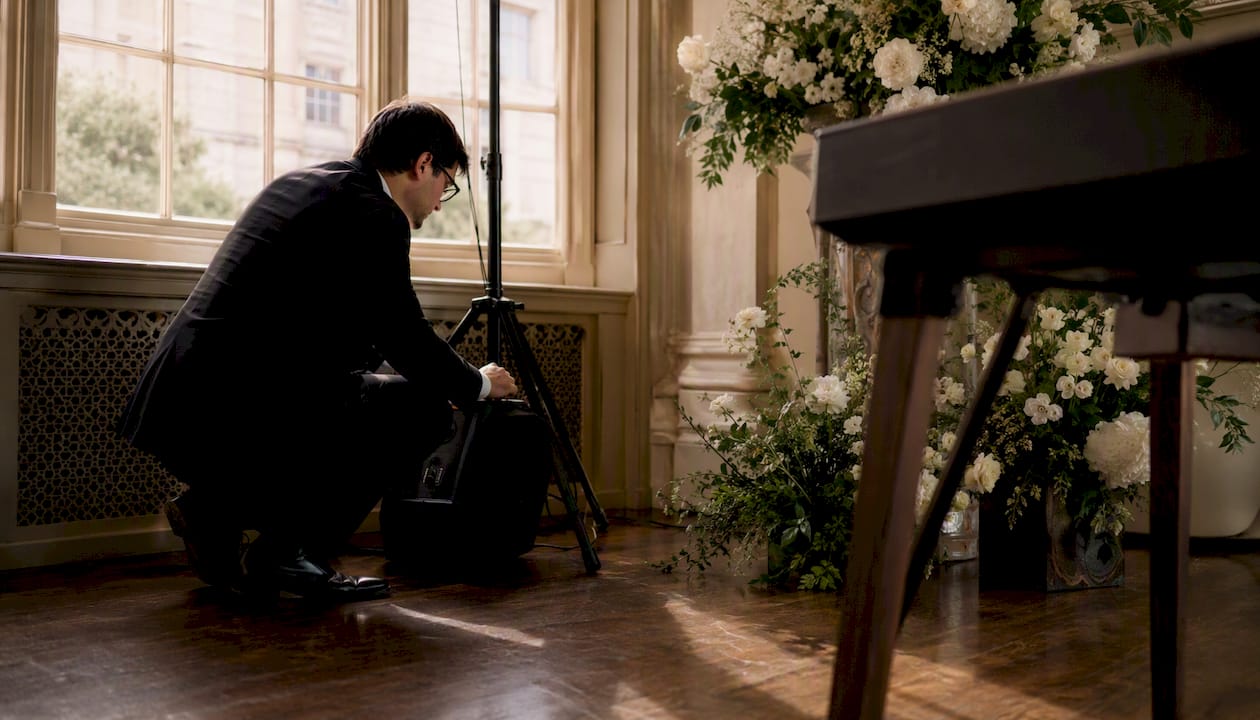 Pianist adjusting digital piano at wedding venue