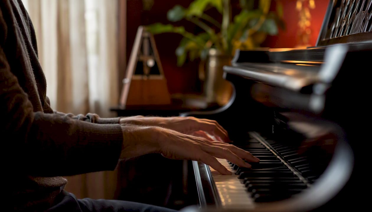 Close-up of hands playing piano scale