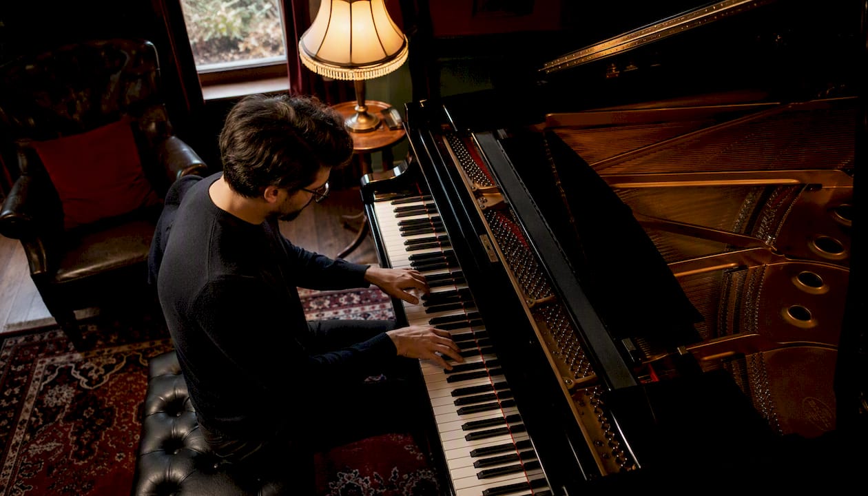 Adult pianist playing classical piano piece