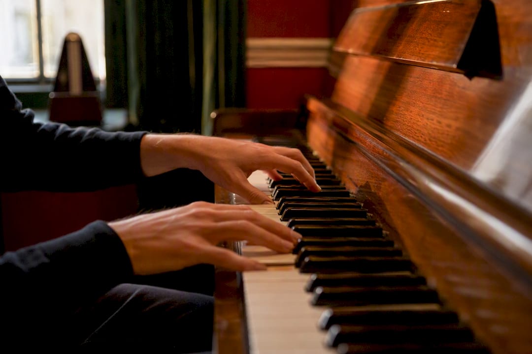 Hands playing jazz piano comping chords