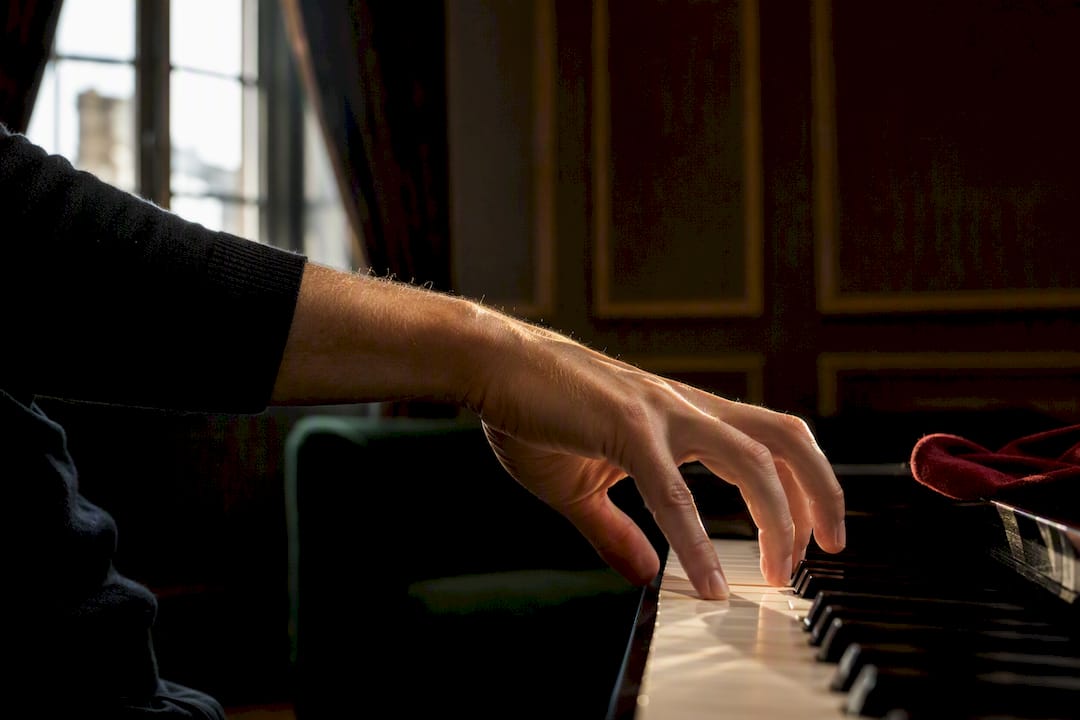 Pianist practising a slow controlled key descent