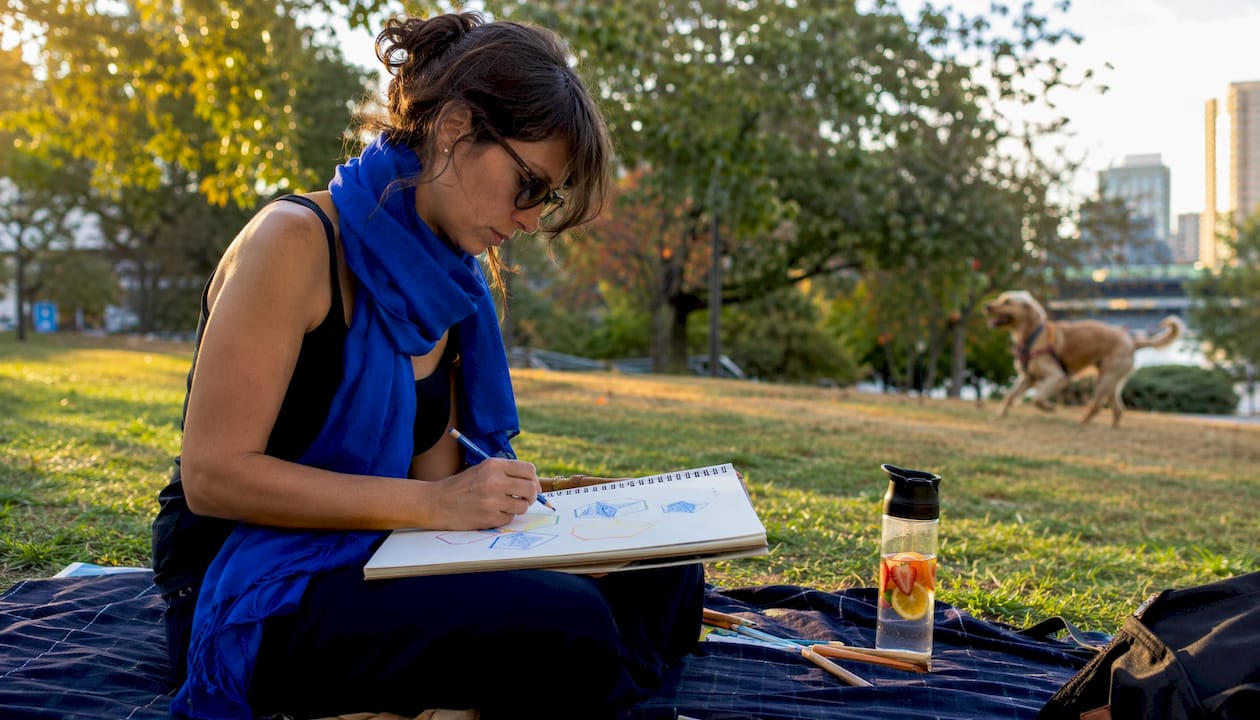 Female designer sketching logos in home office