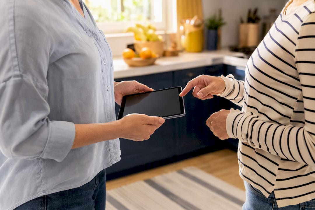 Hands exchanging digital tablet placeholder for agreement