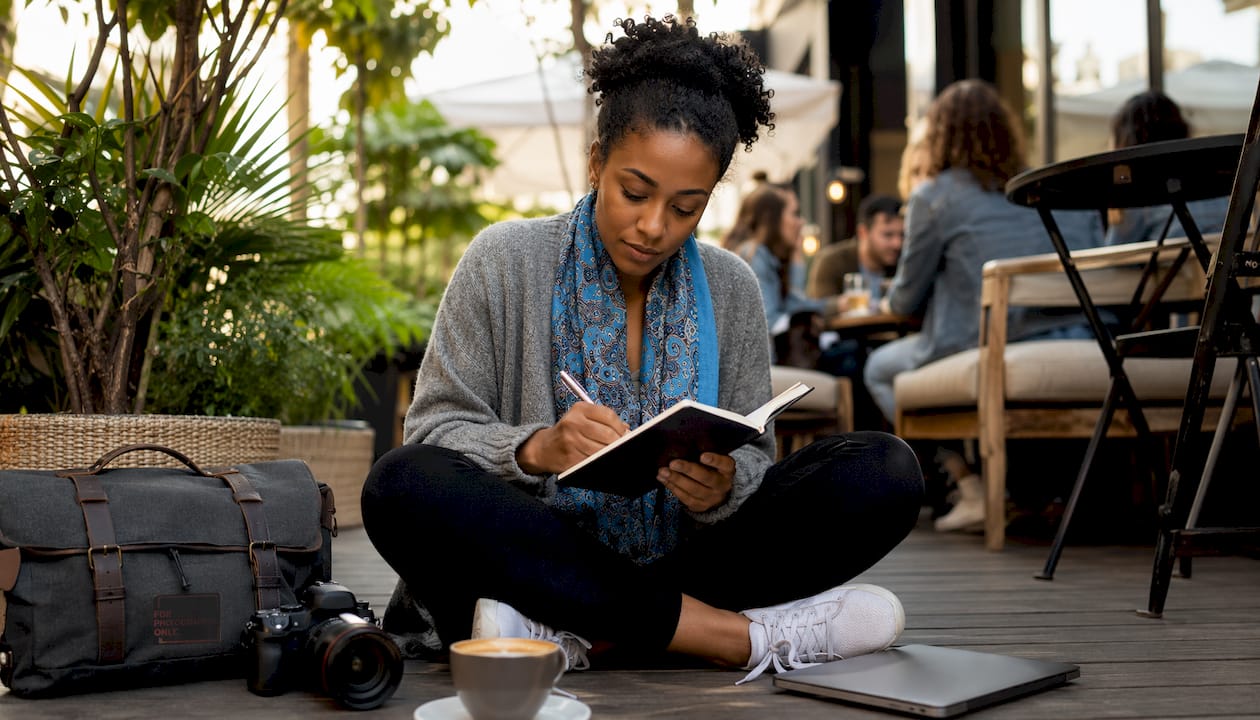 Photographer browsing photography events in coffee shop