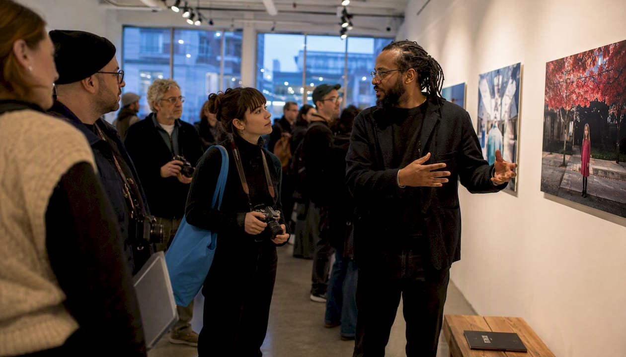 Photographers networking at gallery exhibition event