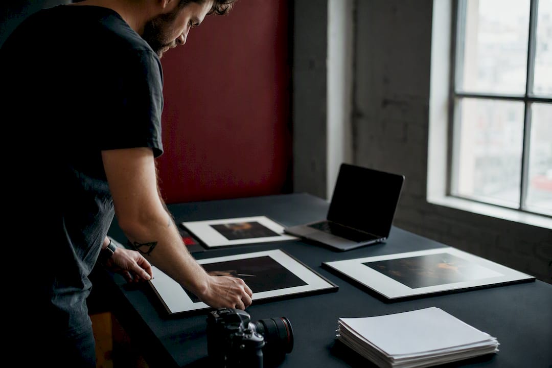 Photographer preparing fine art prints submission