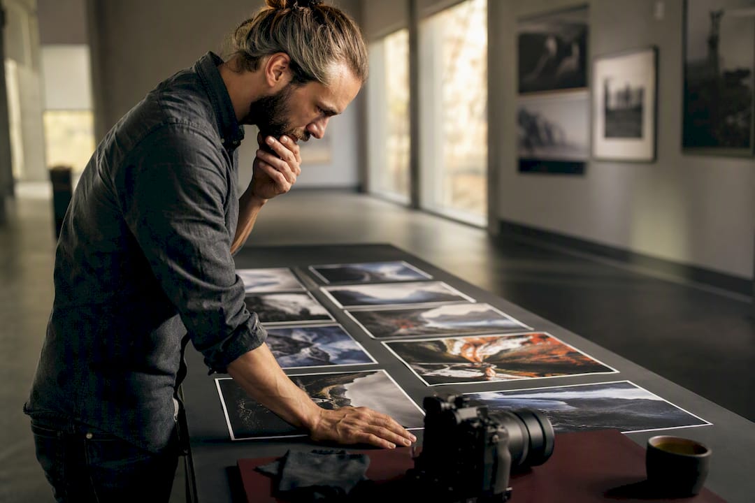 Photographer handling camera and memory cards