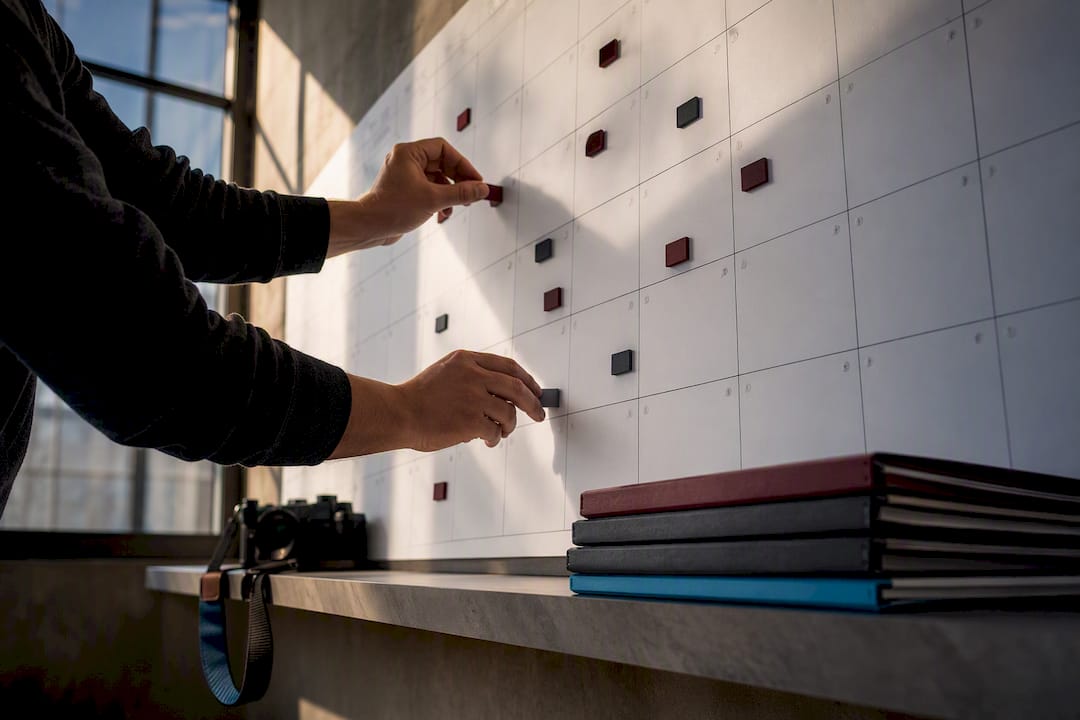 Photographer organizing contest deadlines on calendar
