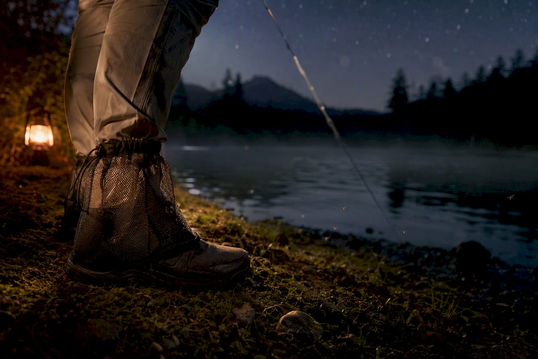 Close-up of fisher's mesh ankle gaiters at night