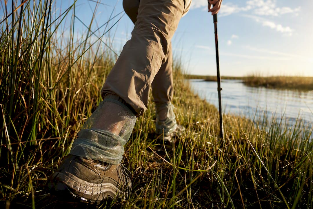 Hiker wearing mesh protection in coastal marsh