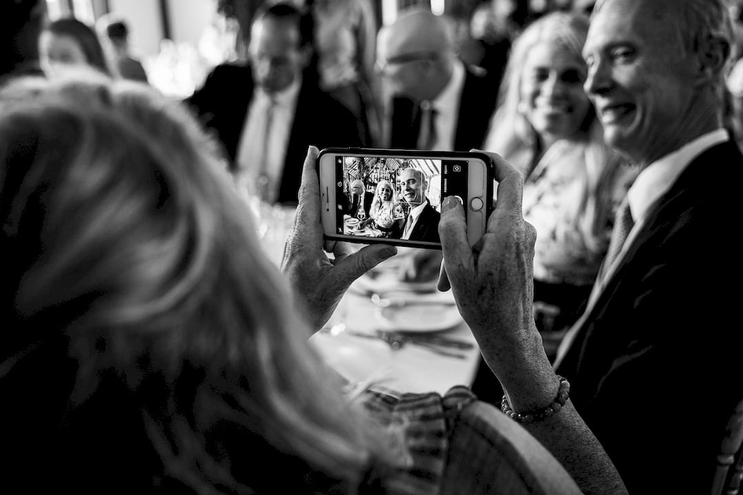 Photographer editing black and white wedding images