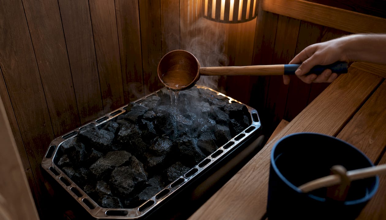 Traditional sauna heater with steaming rocks
