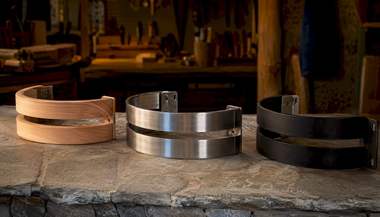 Various sauna heater guard types on workshop table