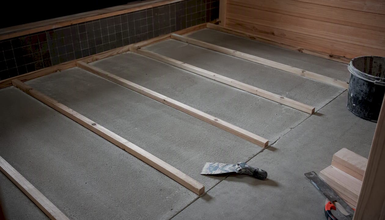 Sauna floor slope construction with cement board