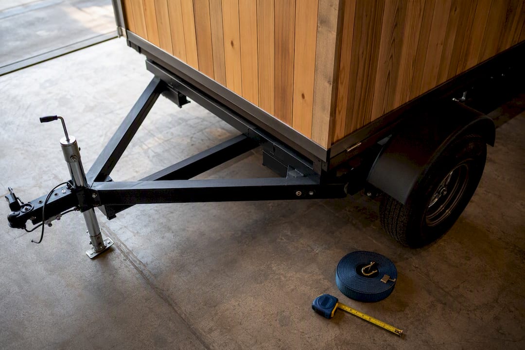 Partial view of compact towable sauna trailer