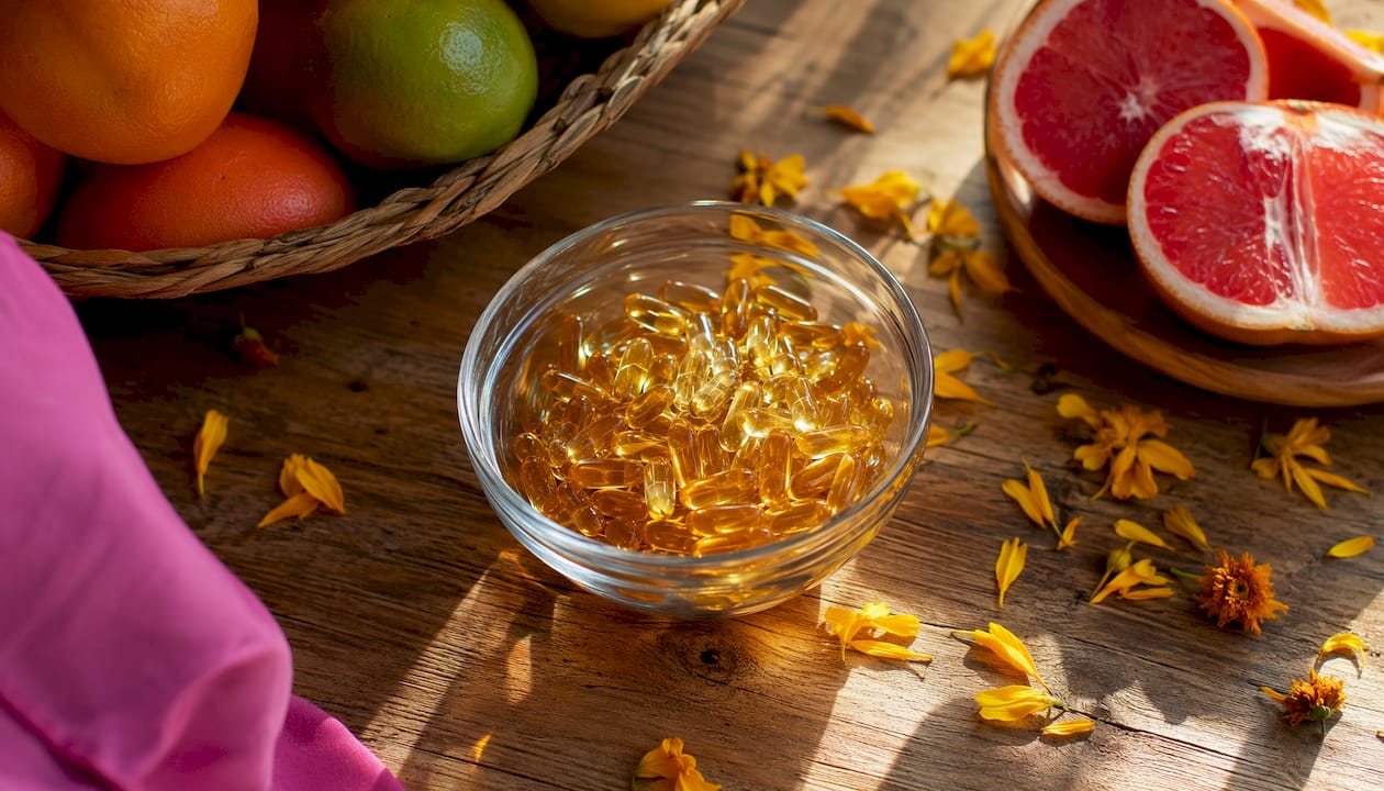 Dish with omega-3 fish oil capsules and lemon slices