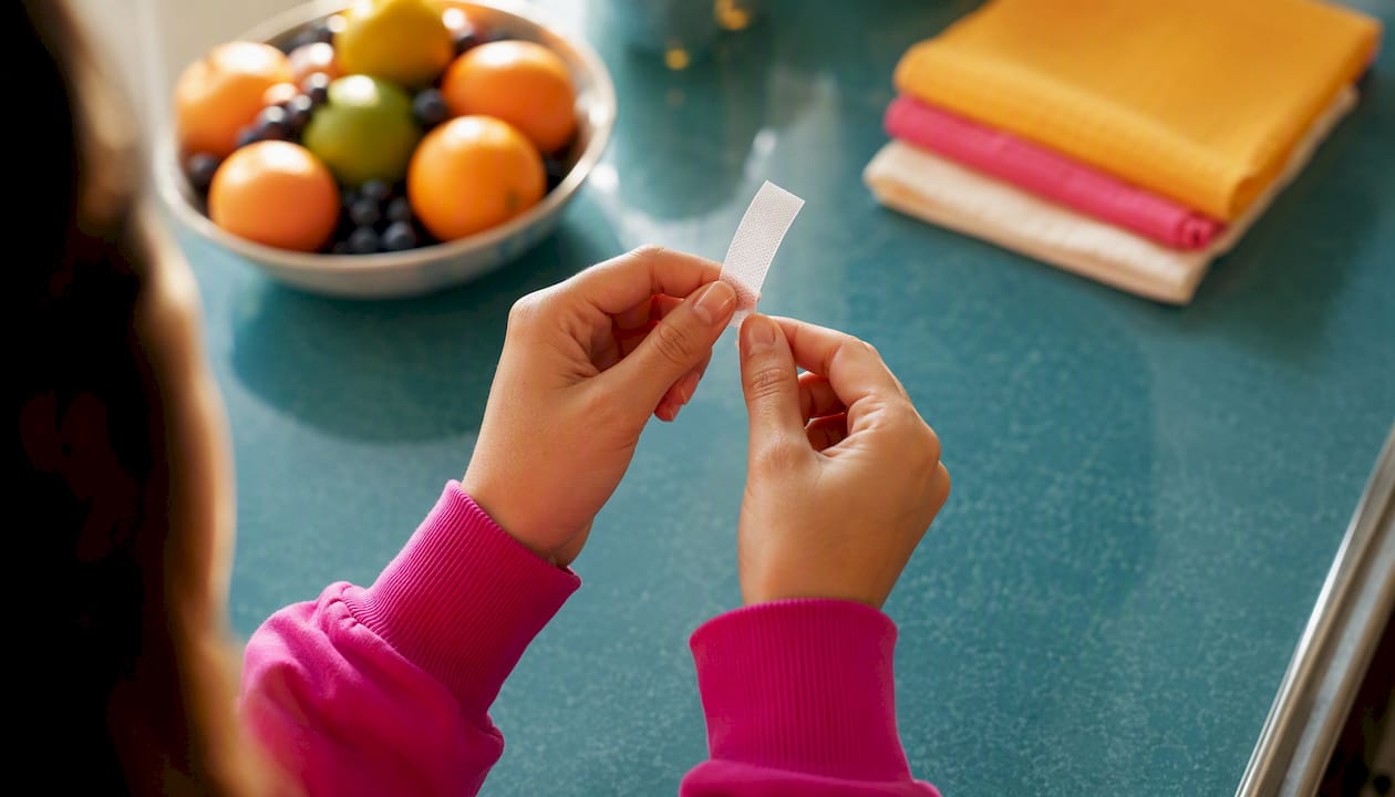 Close-up hands using oral energy strip