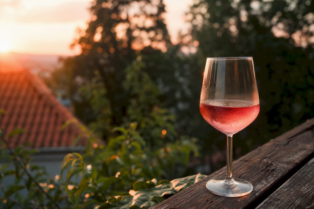 Chilled glass of alcohol on balcony