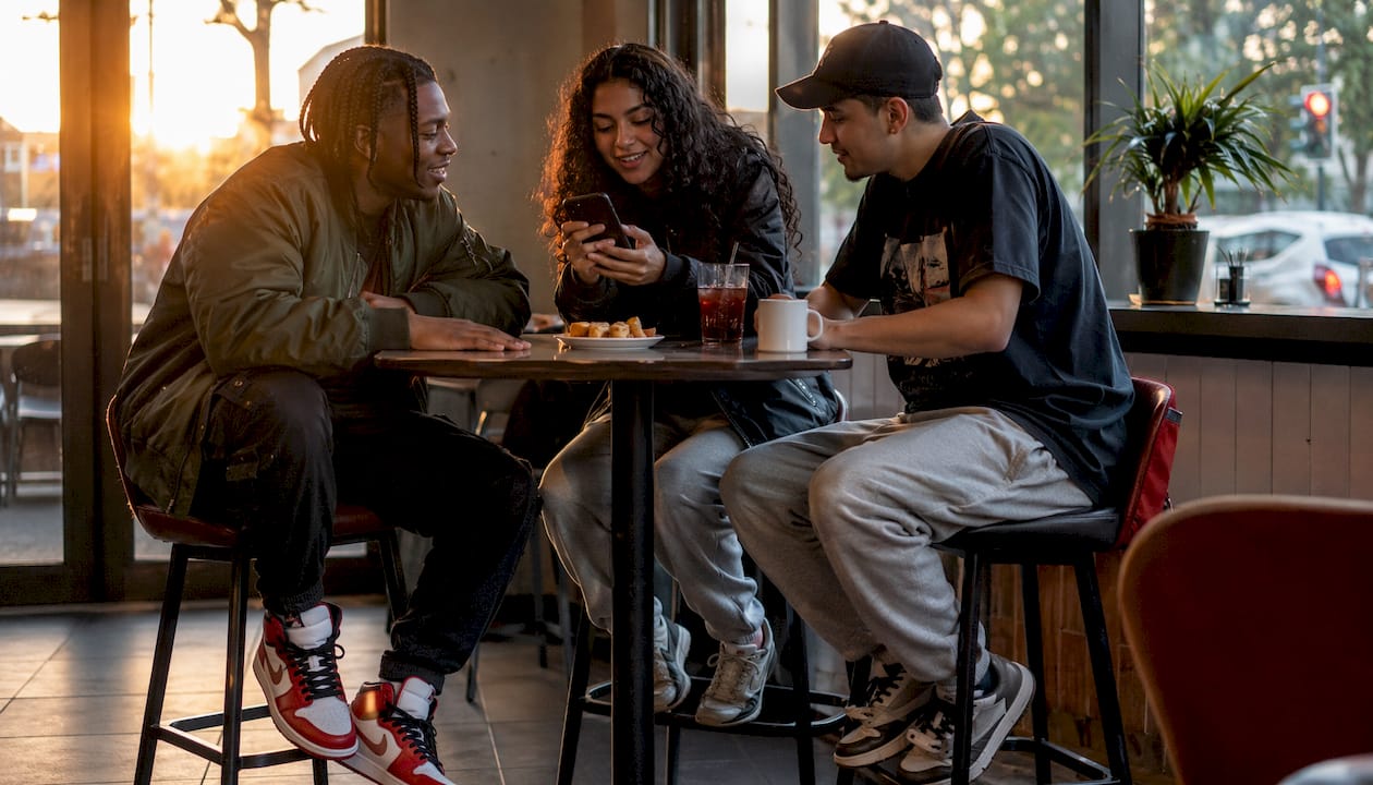Group of young adults wearing joggers in urban park setting