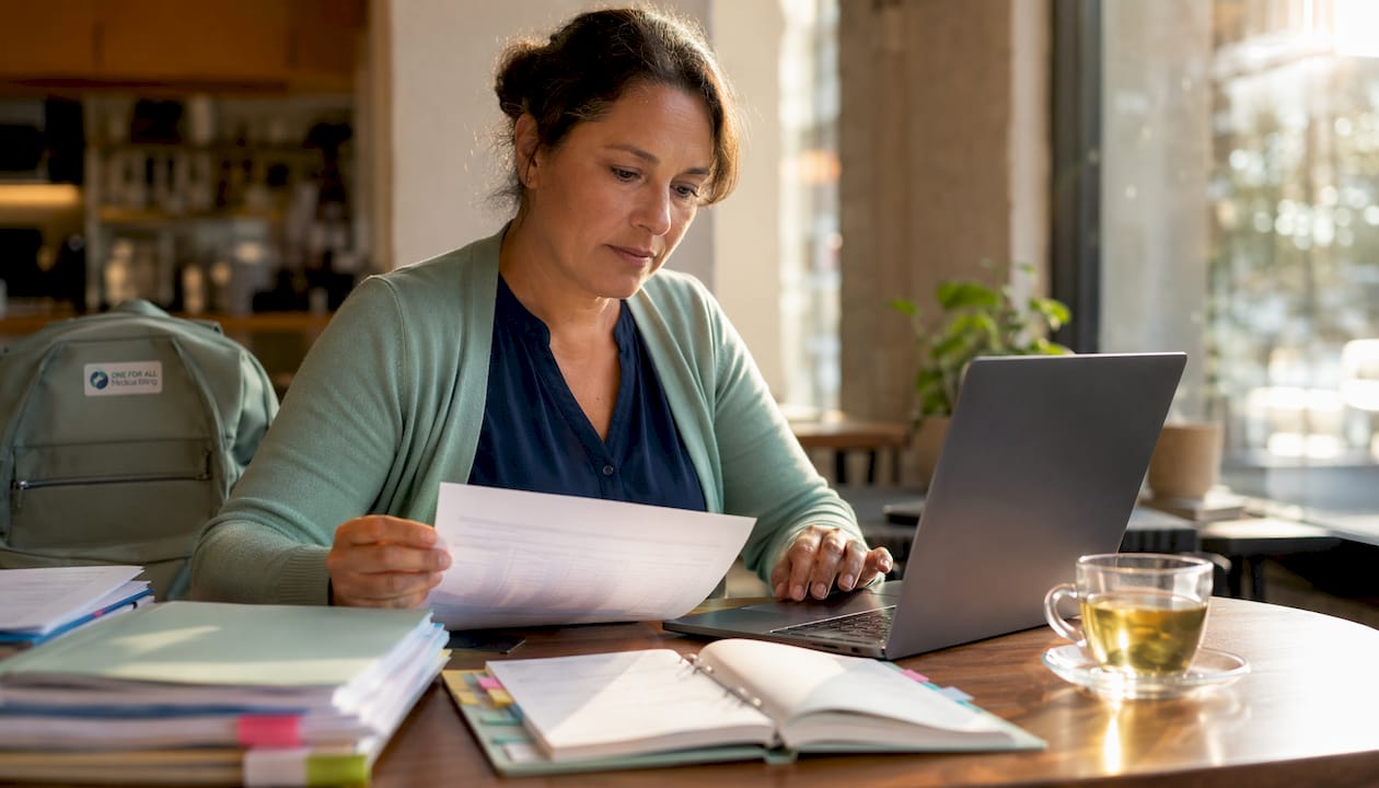 Professional reviewing CMS codes at desk