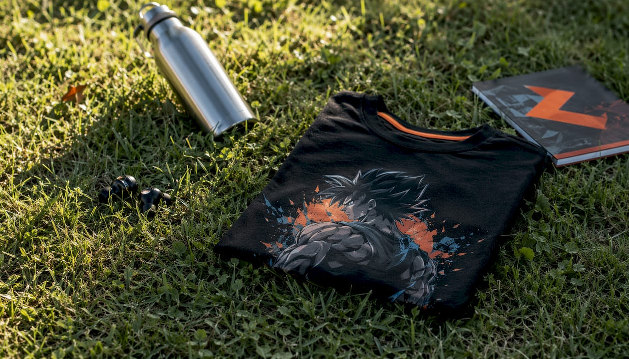 Flat lay of premium cotton anime gym T-shirt with accessories