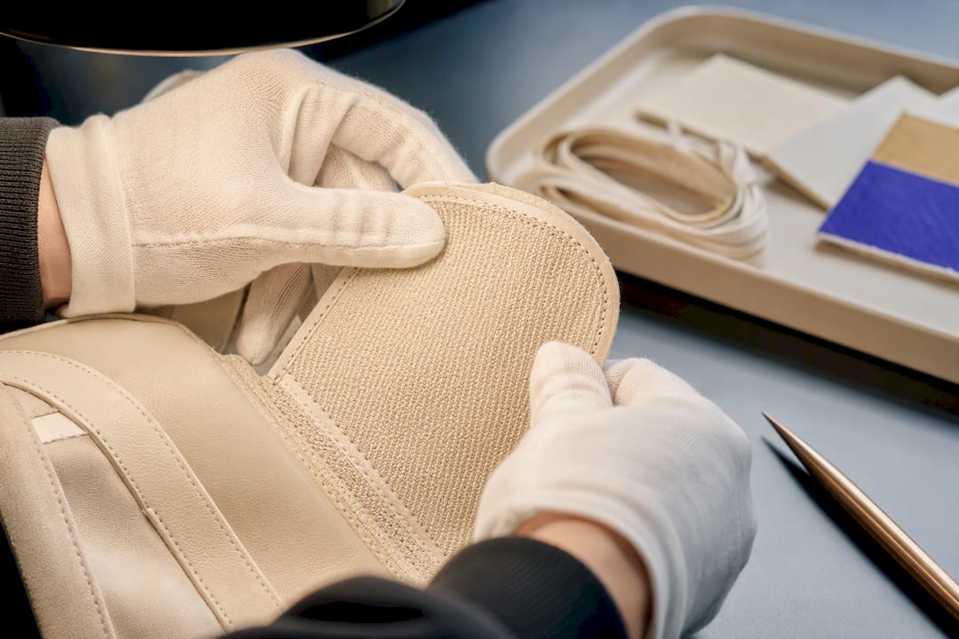 Gloved hands inspecting resale item authenticity
