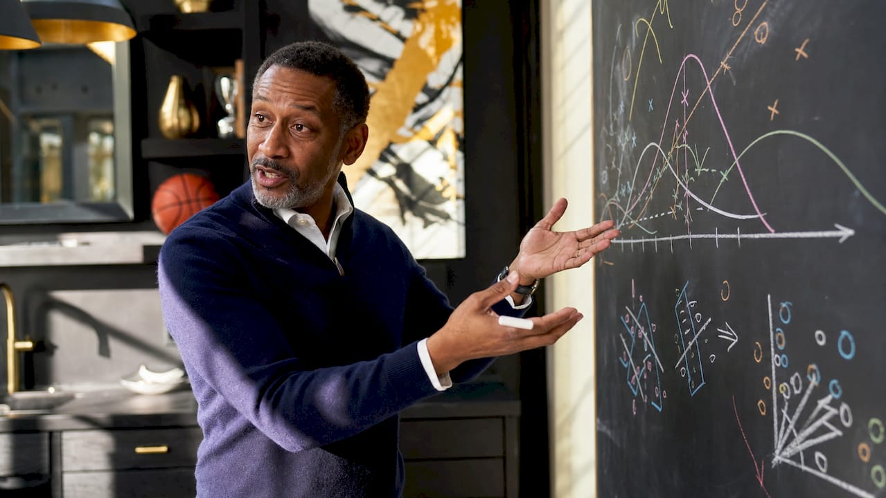 Statistician explaining regression misconceptions at whiteboard