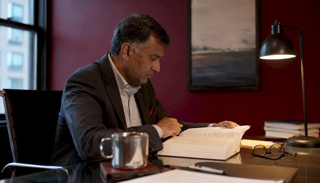 Attorney reading statute of limitations book