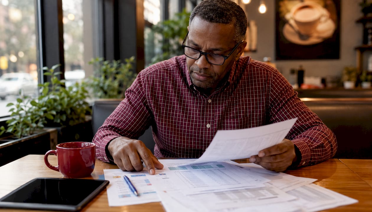 Retail manager reviewing pricing documentation