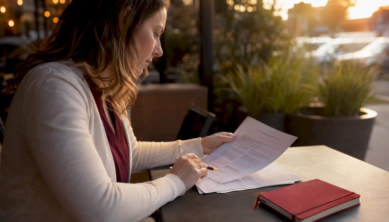 Hands typing and viewing class action listings