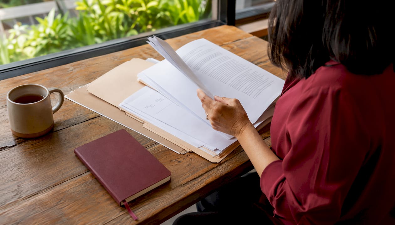 Hands typing in employment law office at desk