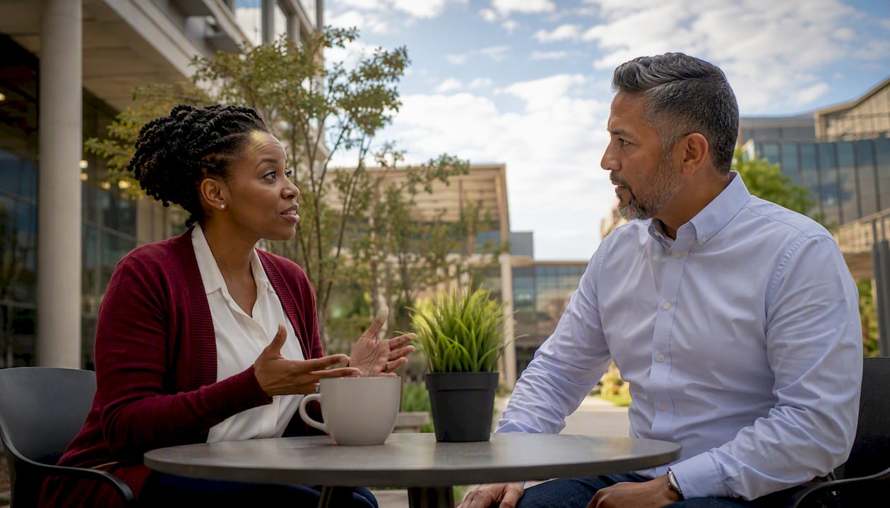 Coworkers discussing hair discrimination policies