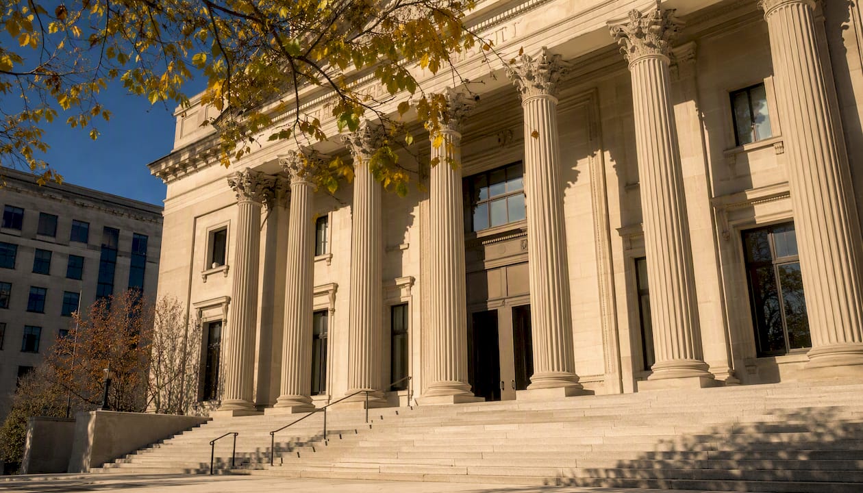 Government building with columns in sunlight