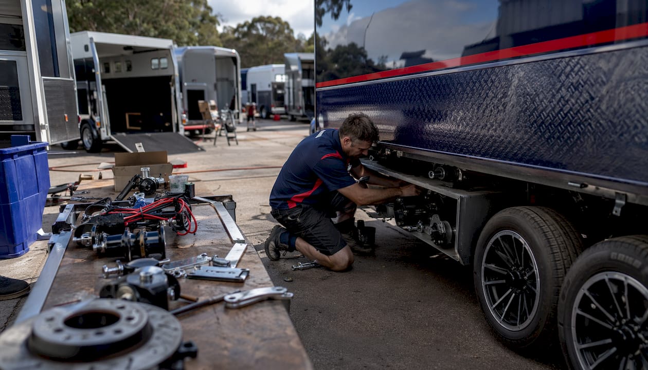 Technician installing horse float electric brakes
