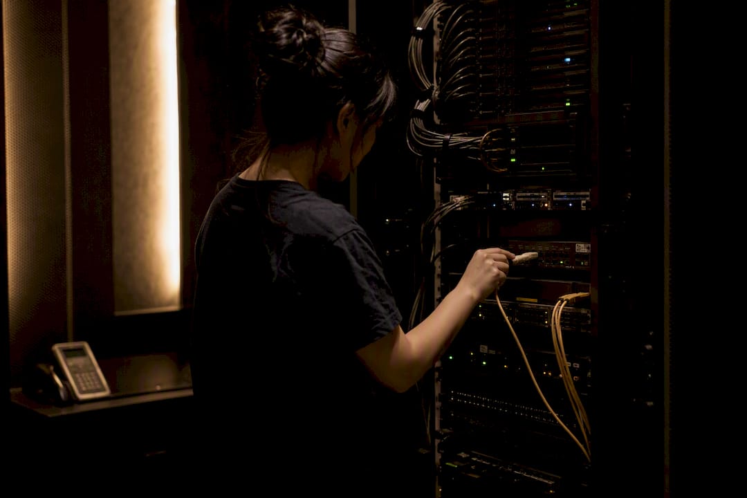 Hands verifying server hardware connection