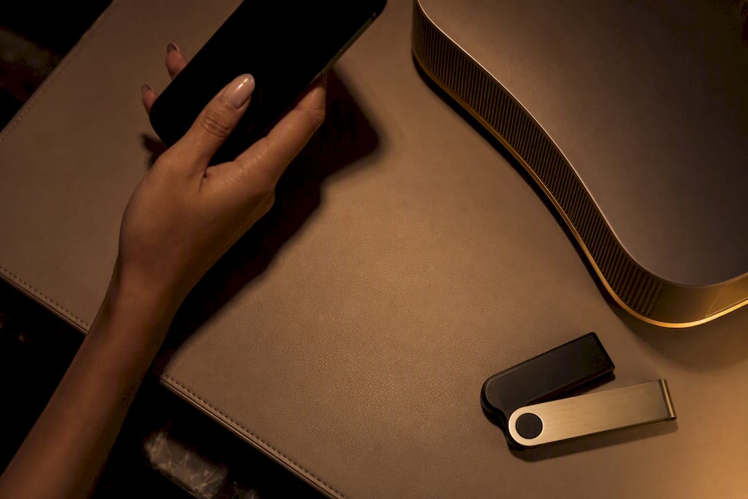 Hands with privacy tech tools in dim setting