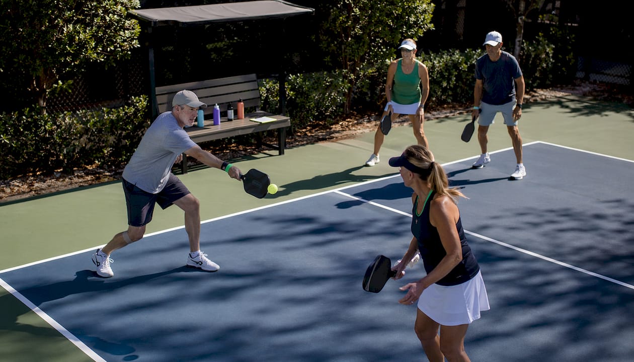 Players playing pickleball on outdoor court