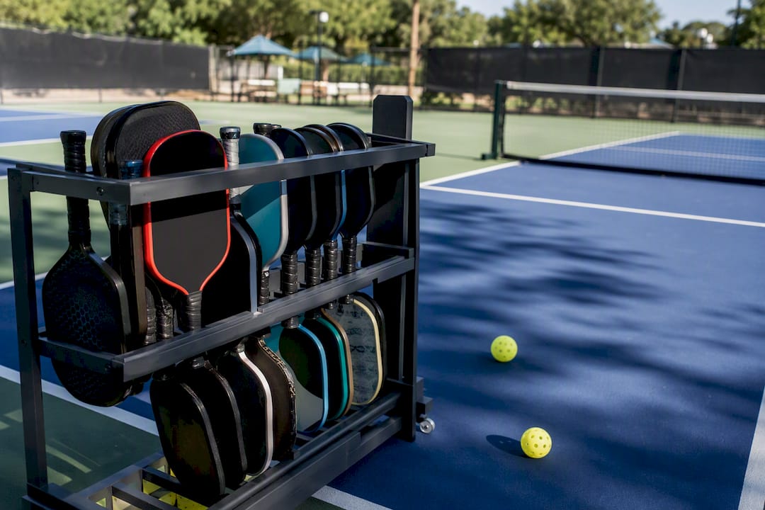 Paddle rack and outdoor pickleball court