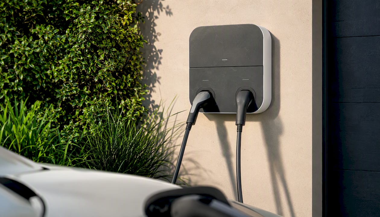 Dual-port EV wall charger close-up outdoors