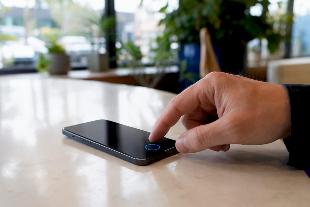 Finger ready to tap call button on phone