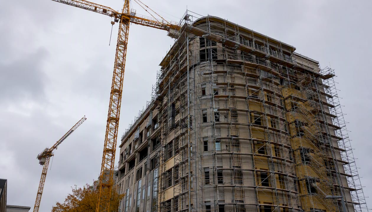 Commercial property under renovation with cranes