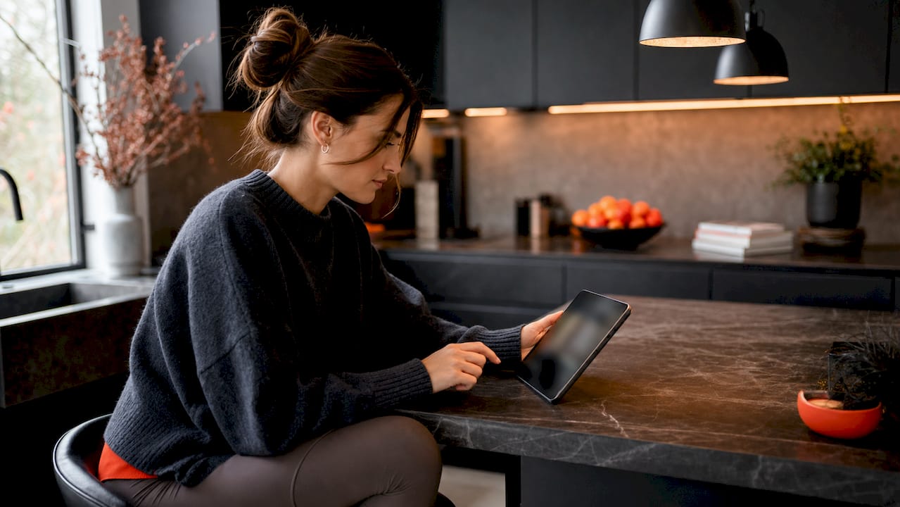 Woman browsing escape room promo codes on tablet