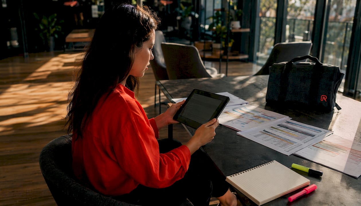 Woman reviewing rental and tour software tablet
