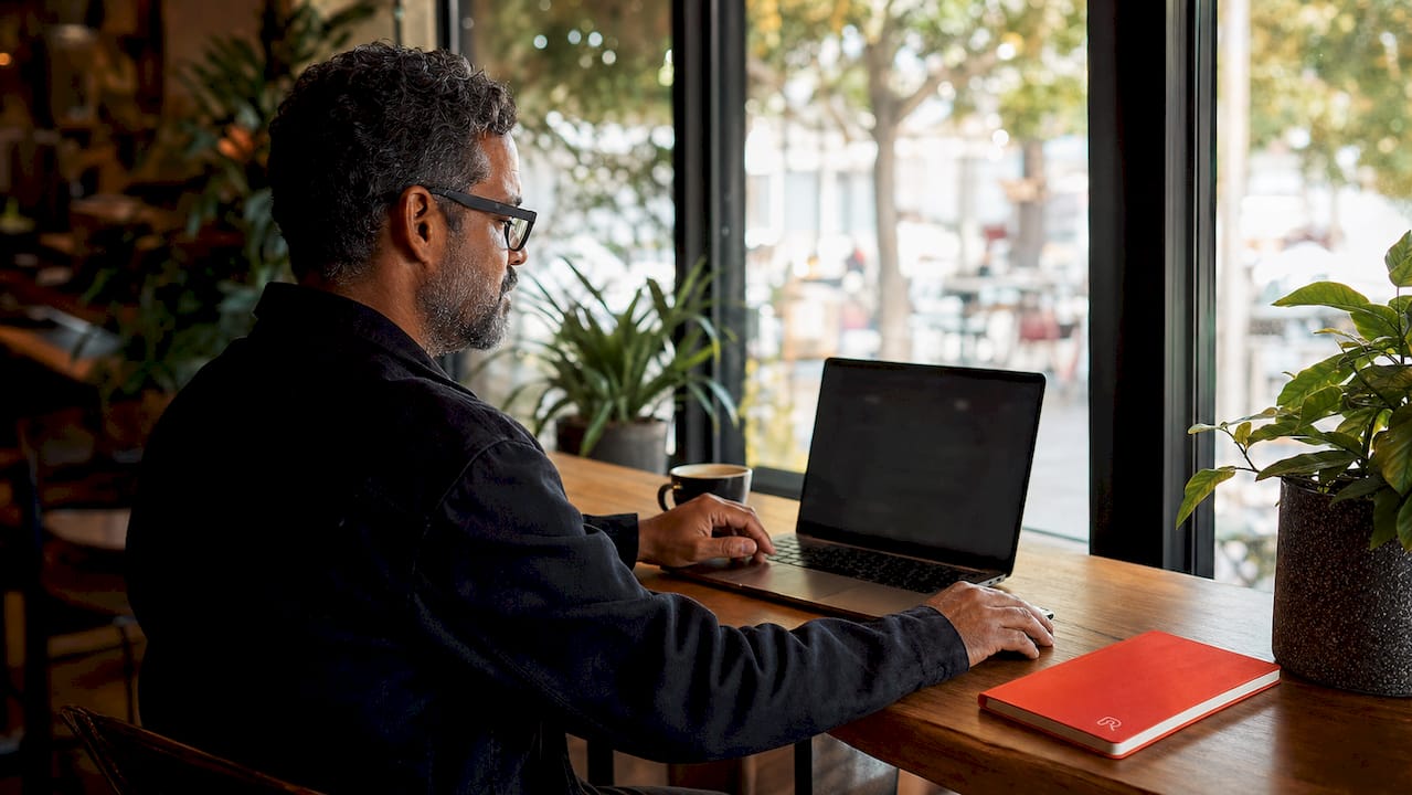 Manager reviewing schedule on laptop