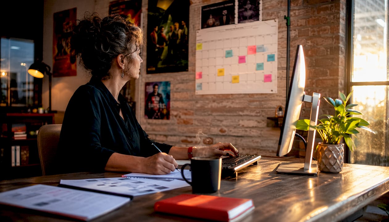 Escape room operator managing bookings at desk