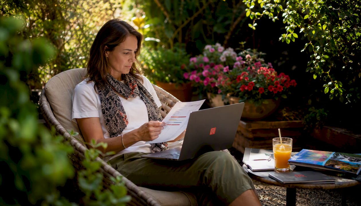 Tour operator reviewing bookings in home office