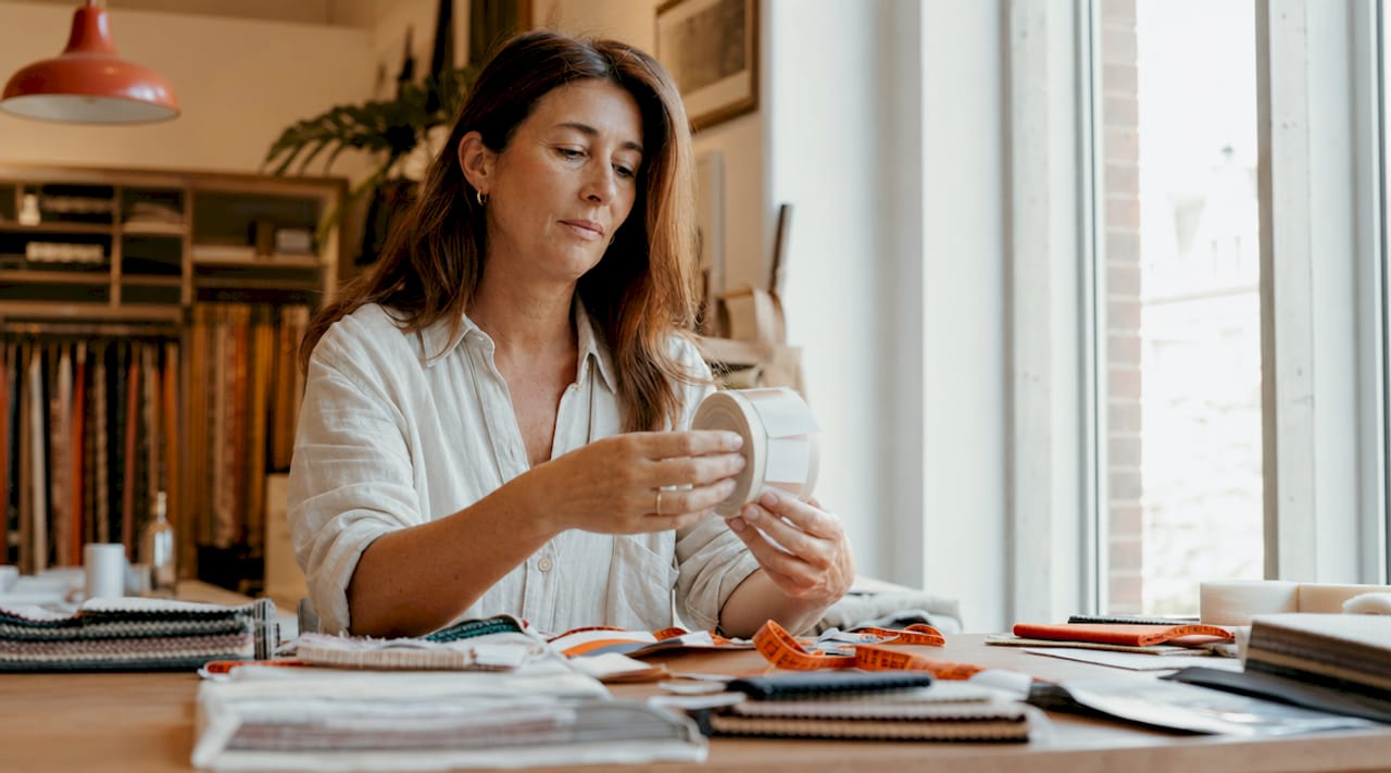 Retail manager inspecting fabric care labels