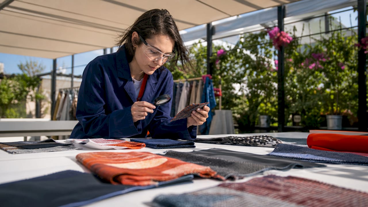 Textile engineer inspecting performance fabric samples